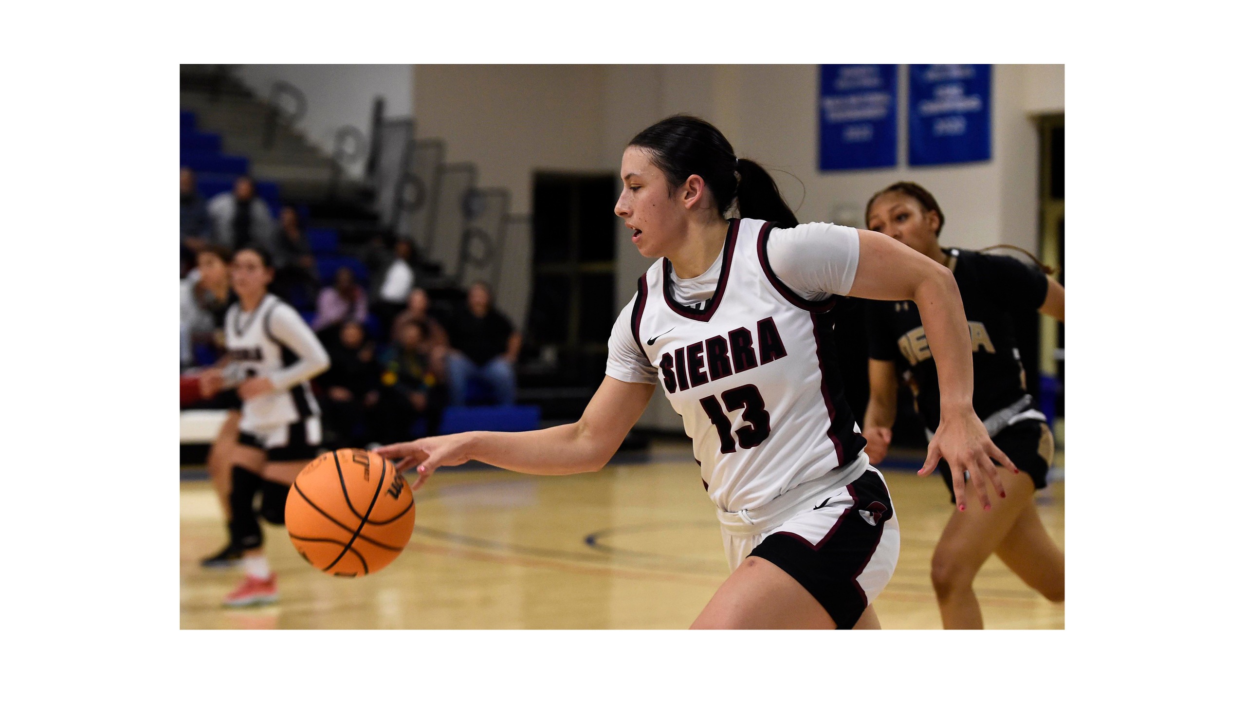 Sierra's 13 dribble down court during Delta game.