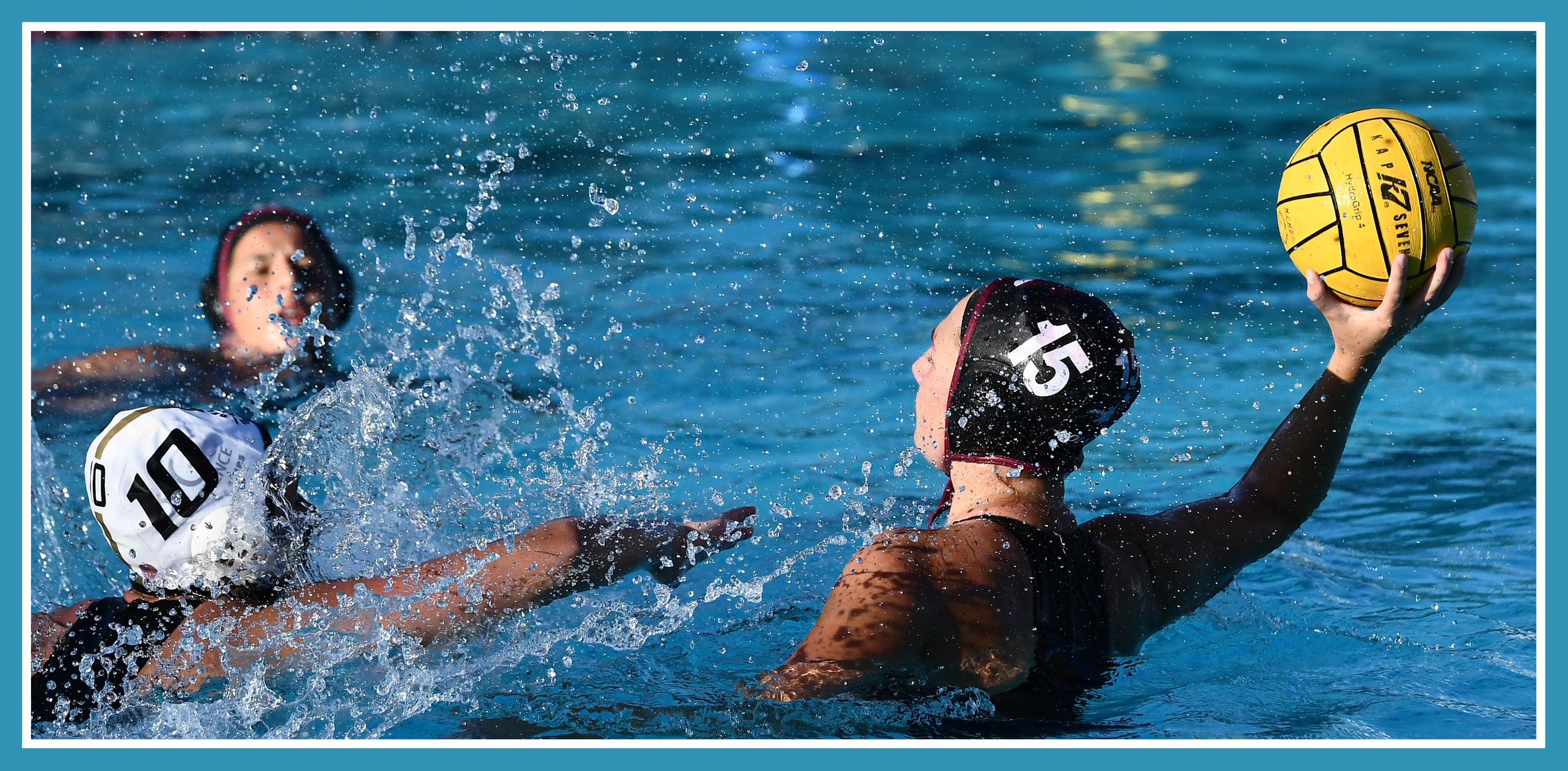 Male waterpolo swimmer passing ball.